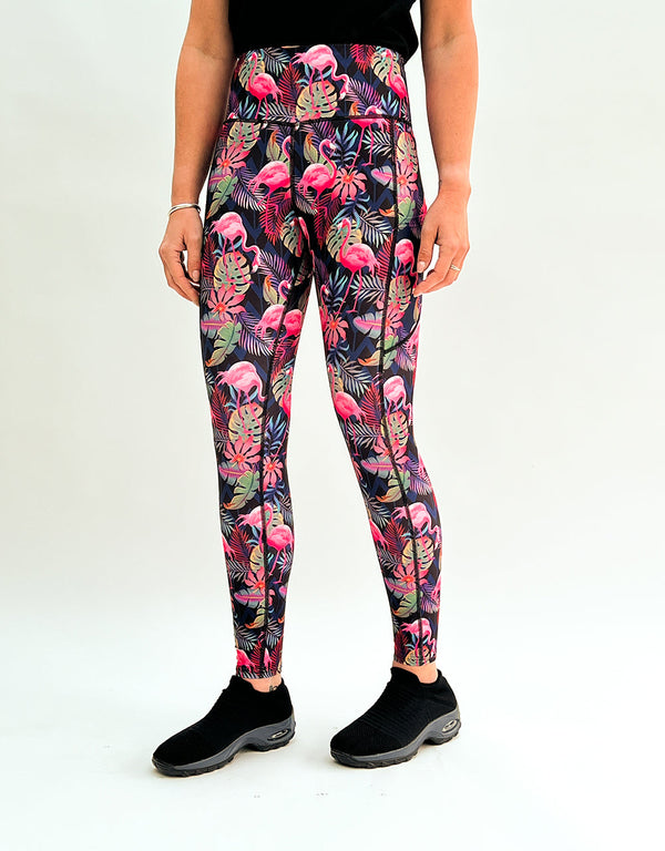 Tropical flamingo print leggings with pockets, high-rise waistband, and soft stretch fabric for activewear.