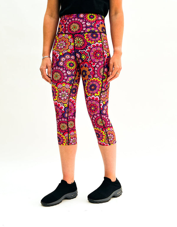 Colorful retro floral gym leggings with high-stretch fabric and side pockets for activewear.