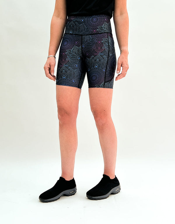 Women's running shorts with midnight mandala pattern, deep pockets, and elastic waistband for comfort and performance
