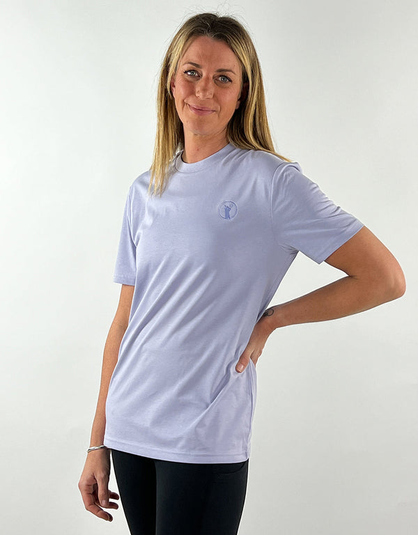 Woman wearing a lavender casual llama t-shirt made from 100% organic cotton with a relaxed fit and embroidered logo
