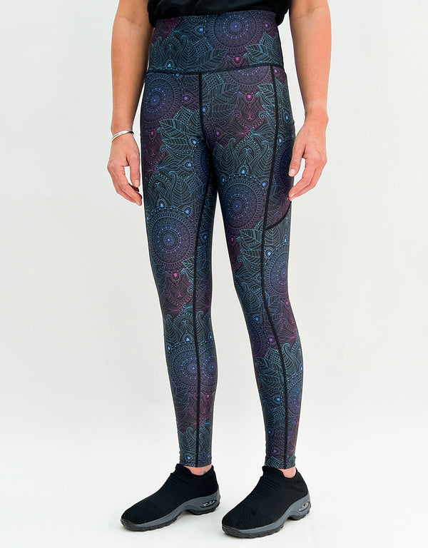 Leggings with a subtle midnight mandala pattern and pockets in dark activewear style.