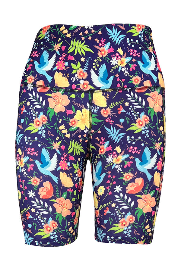 Paradise Birds Shorts with vibrant blue bird and floral print, deep side pockets, and structured stitching on navy background