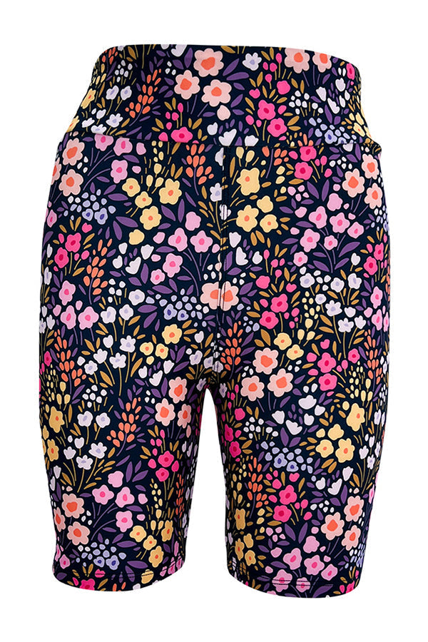 Floral Petal Paradise tight shorts with colorful meadow-inspired print and elastic waistband.