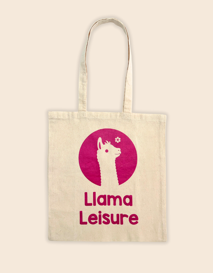 Llama tote bag with pink llama graphic and "Llama Leisure" text on beige canvas background