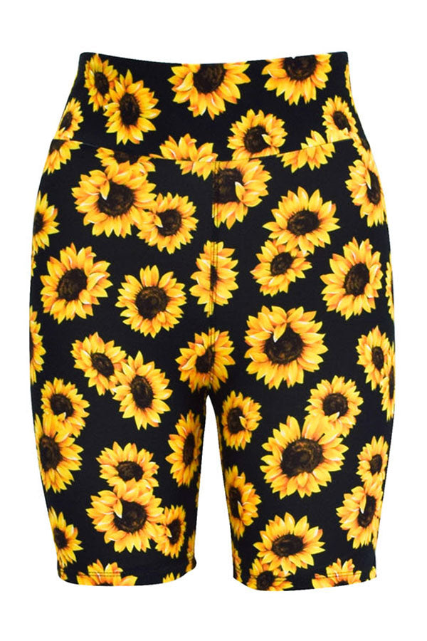 Black tight shorts with vibrant yellow sunflower print and wide waistband